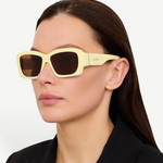 KABE SHOP INC Croisiere rectangular sunglasses in sand acetate with brown lenses worn by a woman