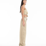 A woman stands sideways and smiles, wearing a beige sleeveless top paired with Cold Dye Boyfriend Jeans with Patch Pockets in a matching high-waisted, wide-leg style against a white background.