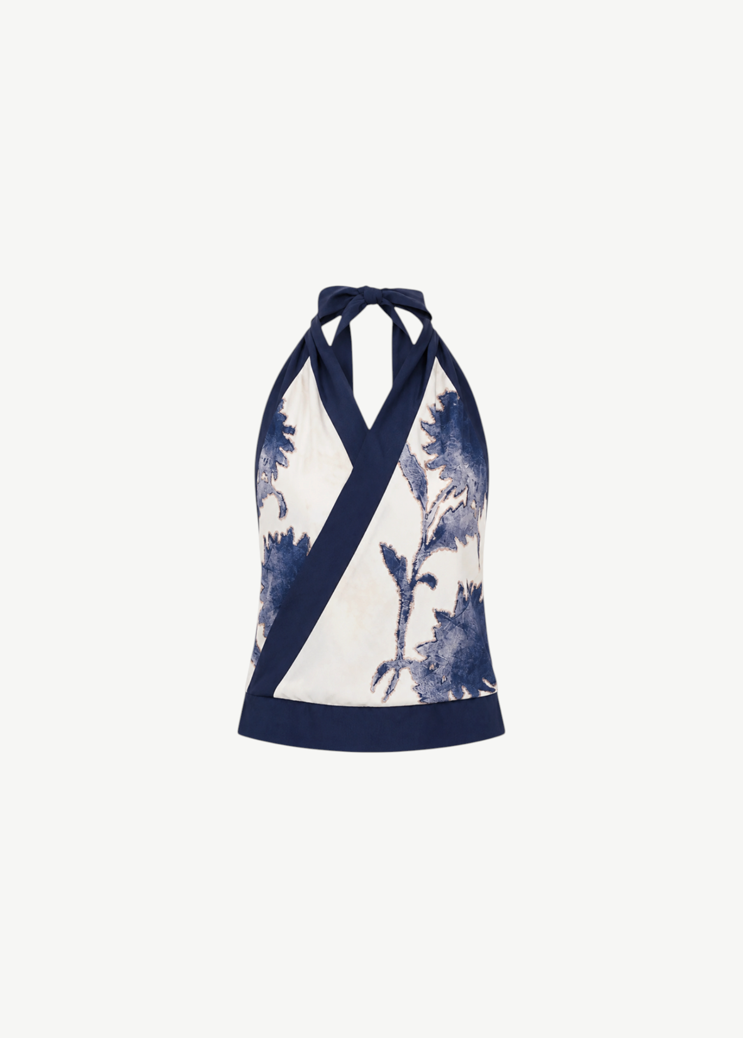 Phillipa Halter Scarf Top featuring a sleeveless floral print with a dark blue wrap-style neckline in a cream and blue pattern.