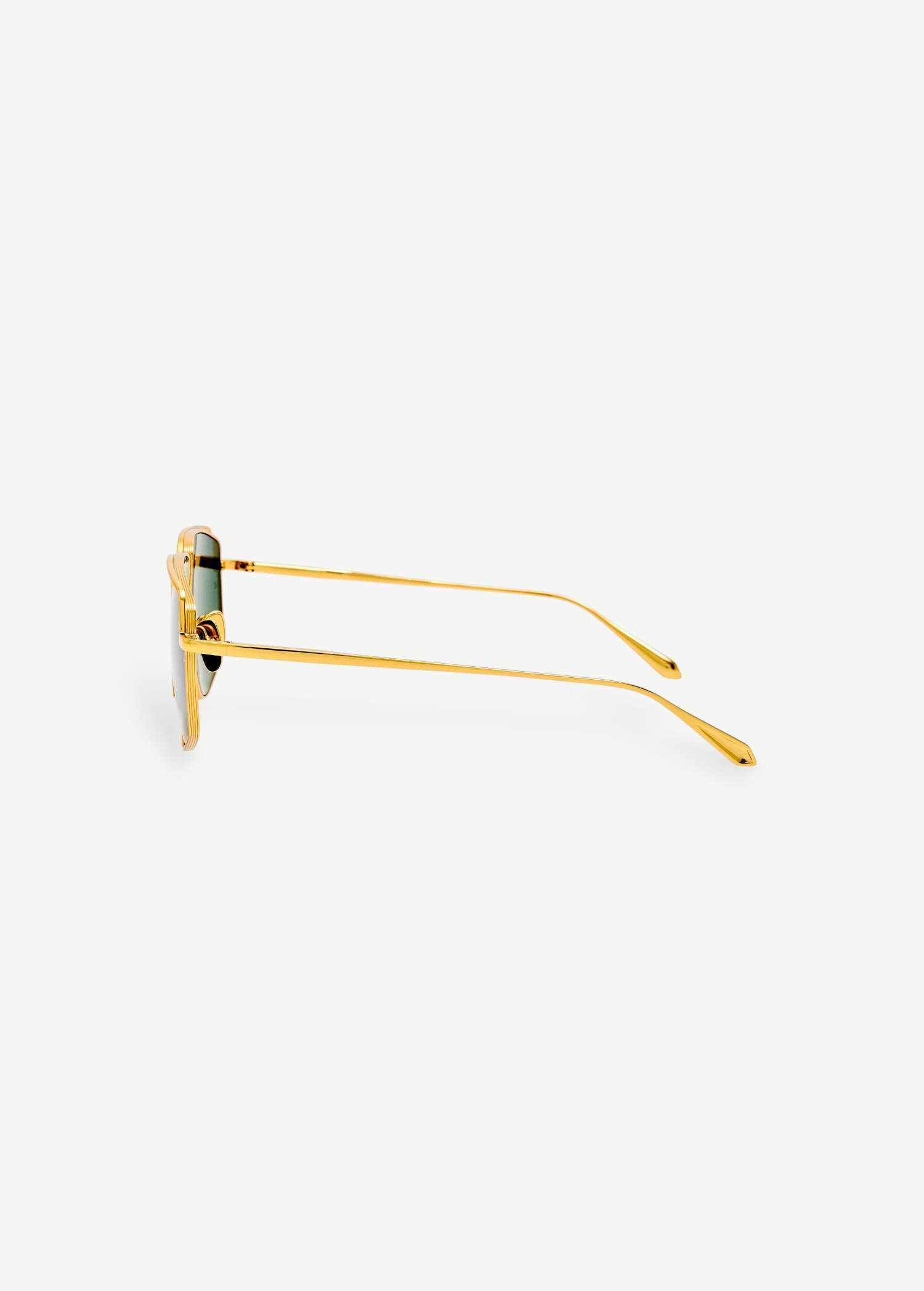 Side view of Miranda Sunglasses, featuring gold-plated frames with green lenses, displayed against a plain white background. The thin Japanese titanium arms are gently curved at the ends, enhancing the modern, sleek look of the oversized design.