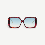 The Macy Sunglasses feature a square, oversized silhouette with a tortoiseshell acetate frame and blue gradient lenses, displayed facing forward against a plain white background.