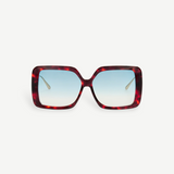 The Macy Sunglasses feature a square, oversized silhouette with a tortoiseshell acetate frame and blue gradient lenses, displayed facing forward against a plain white background.