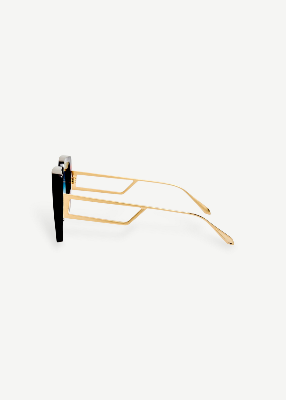 Side view of the Macy Sunglasses with gold geometric temples and black oversized frames, featuring aqua gradient lenses, displayed on a plain white background.