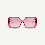 Front view of the Macy Sunglasses, showcasing oversized, square-shaped frames crafted from luxurious Italian acetate in translucent pink, complemented by matching pink-tinted lenses and elegant gold plated temples, set against a plain white background.