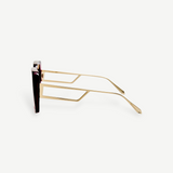 Macy Sunglasses with gold-plated temples, geometric cut-out temple arms, and dark lenses are shown in a side profile view against a plain white background.