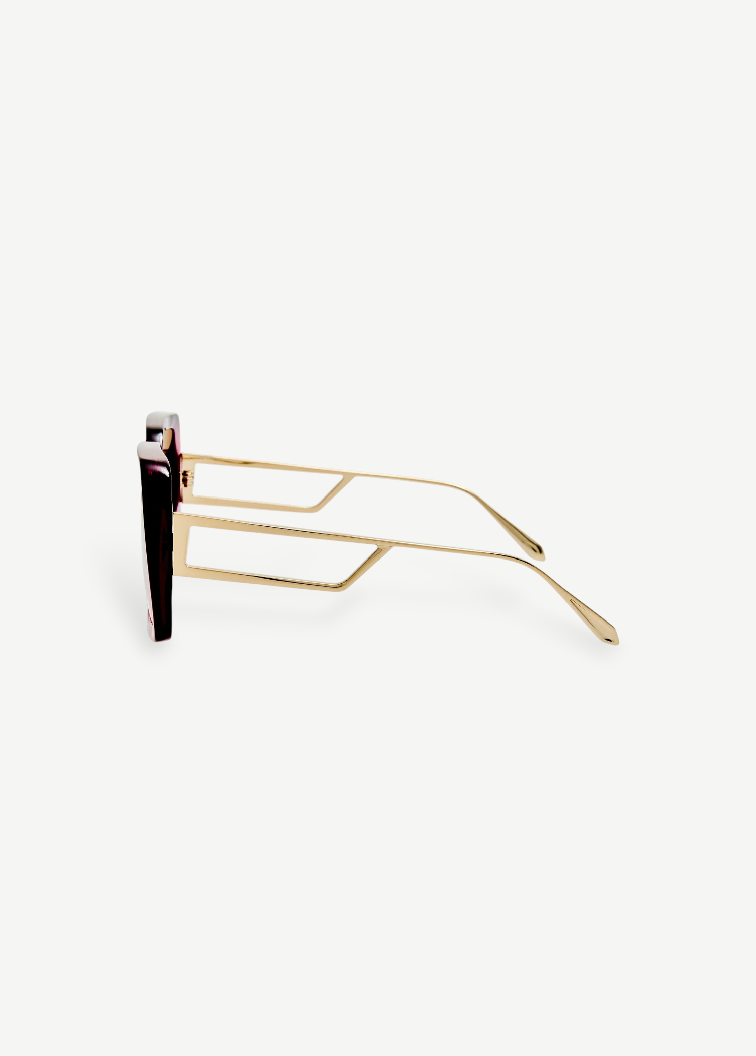 Macy Sunglasses with gold-plated temples, geometric cut-out temple arms, and dark lenses are shown in a side profile view against a plain white background.