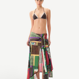 KABE SHOP INC Lumier skirt featuring a multi-colored patchwork print with an asymmetrical hem and draped front