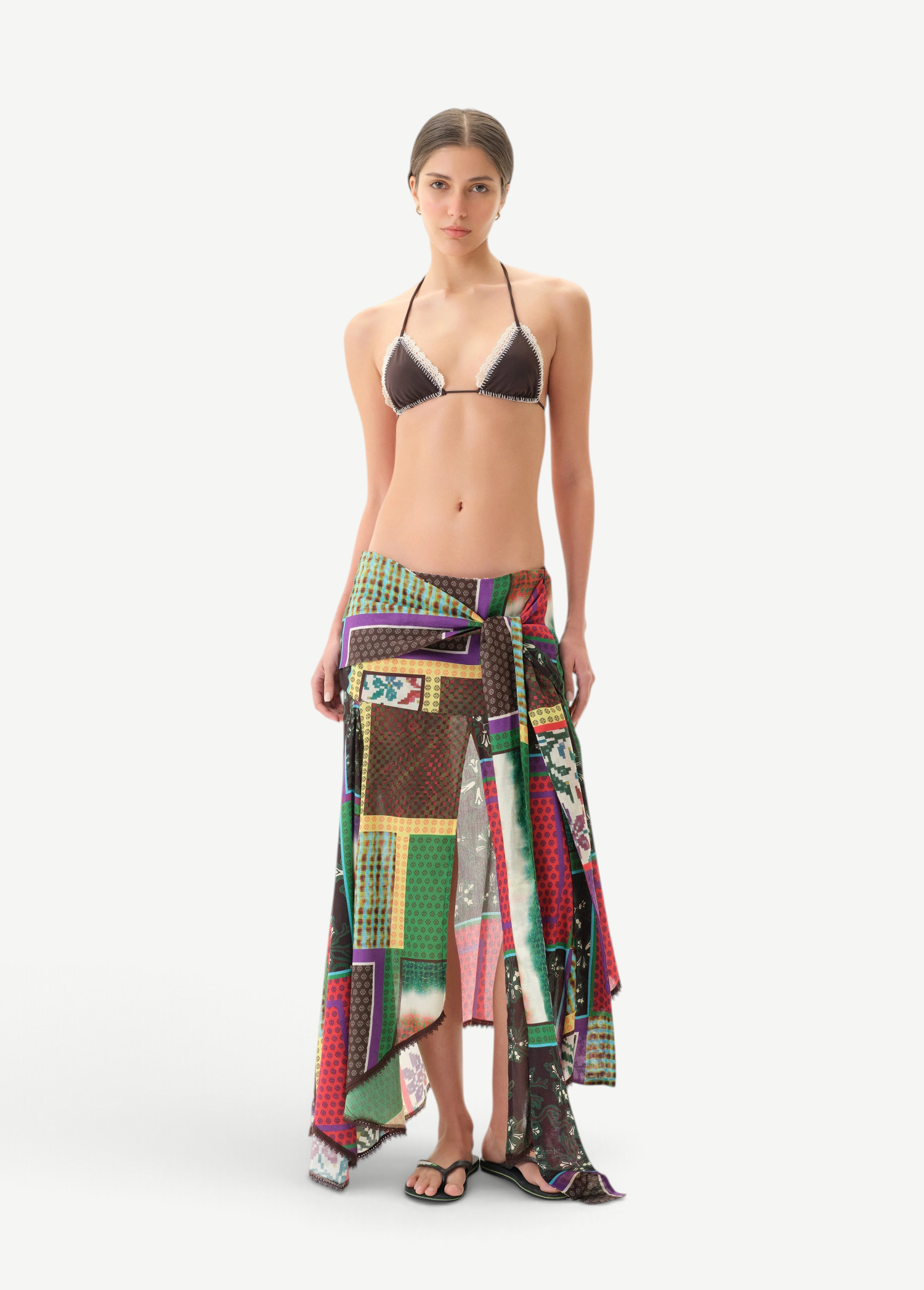 KABE SHOP INC Lumier skirt featuring a multi-colored patchwork print with an asymmetrical hem and draped front