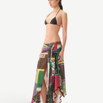 KABE SHOP INC Lumier skirt featuring a vibrant patchwork print, asymmetrical hem, and delicate lace trim on a model