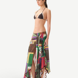 KABE SHOP INC Lumier skirt featuring a vibrant patchwork print, asymmetrical hem, and delicate lace trim on a model