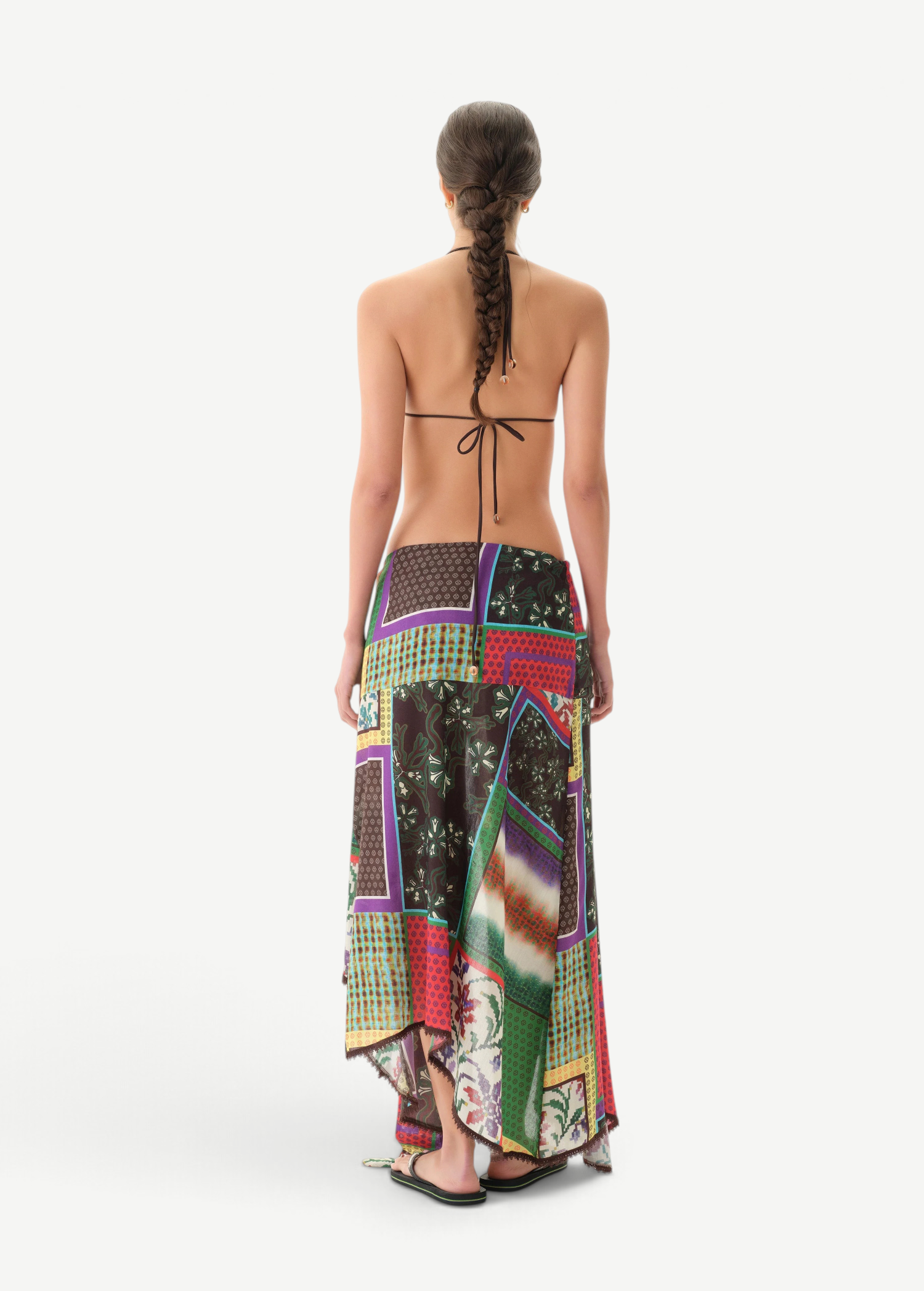 KABE SHOP INC Lumier skirt featuring a multi-colored patchwork print with an asymmetrical hem and draped silhouette.