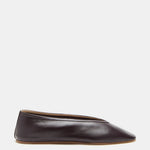 A single Luna Slipper Shoe in dark brown, crafted from supple plum lambskin with minimalist seamless leather detailing and a slightly pointed toe, is displayed in side profile against a plain white background.