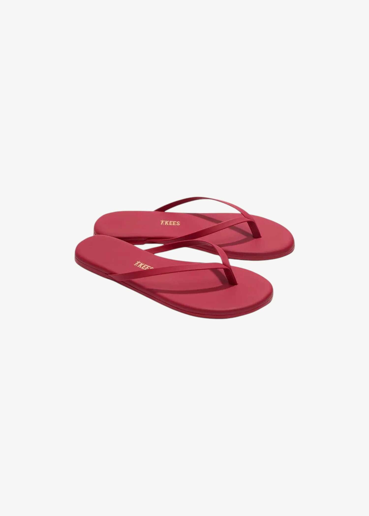 Red flip-flops with a brand logo on a white background
