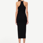 Back view of a model wearing a KABE SHOP INC black ribbed midi dress with a racerback design and slim fit.