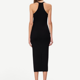 Back view of a model wearing a KABE SHOP INC black ribbed midi dress with a racerback design and slim fit.