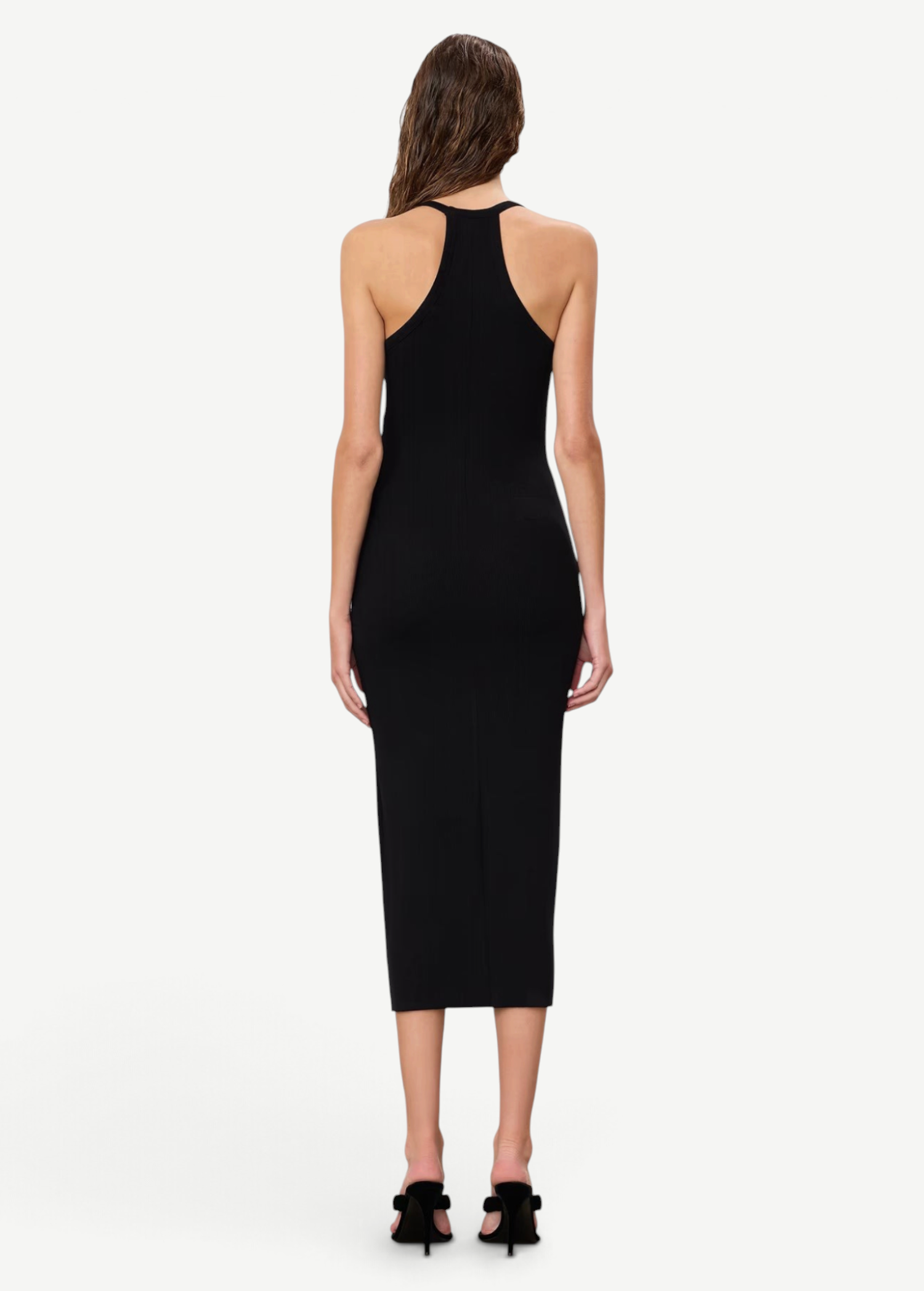 Back view of a model wearing a KABE SHOP INC black ribbed midi dress with a racerback design and slim fit.