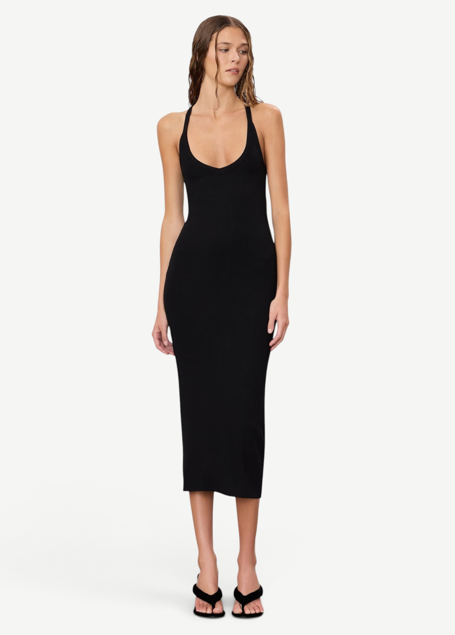Model wearing a KABE SHOP INC black ribbed V-neck racerback midi dress with a slim fit against a neutral background.