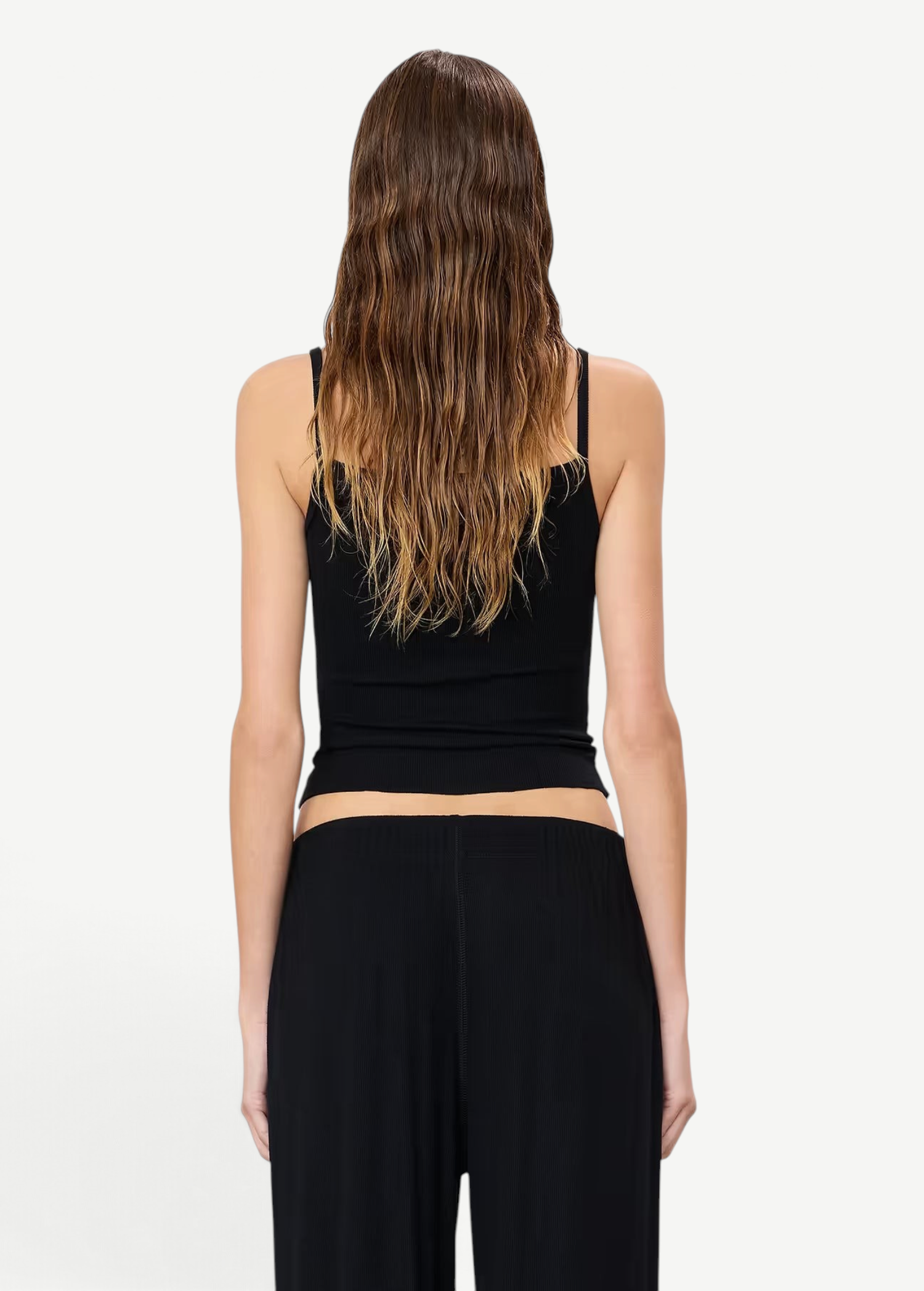Back view of a woman wearing a KABE SHOP INC black slim-fit jersey modal tank top with double-lined construction.