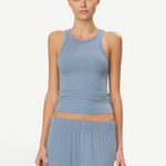 KABE SHOP INC high neck fitted tank in blue ribbed fabric worn by a model against a neutral background