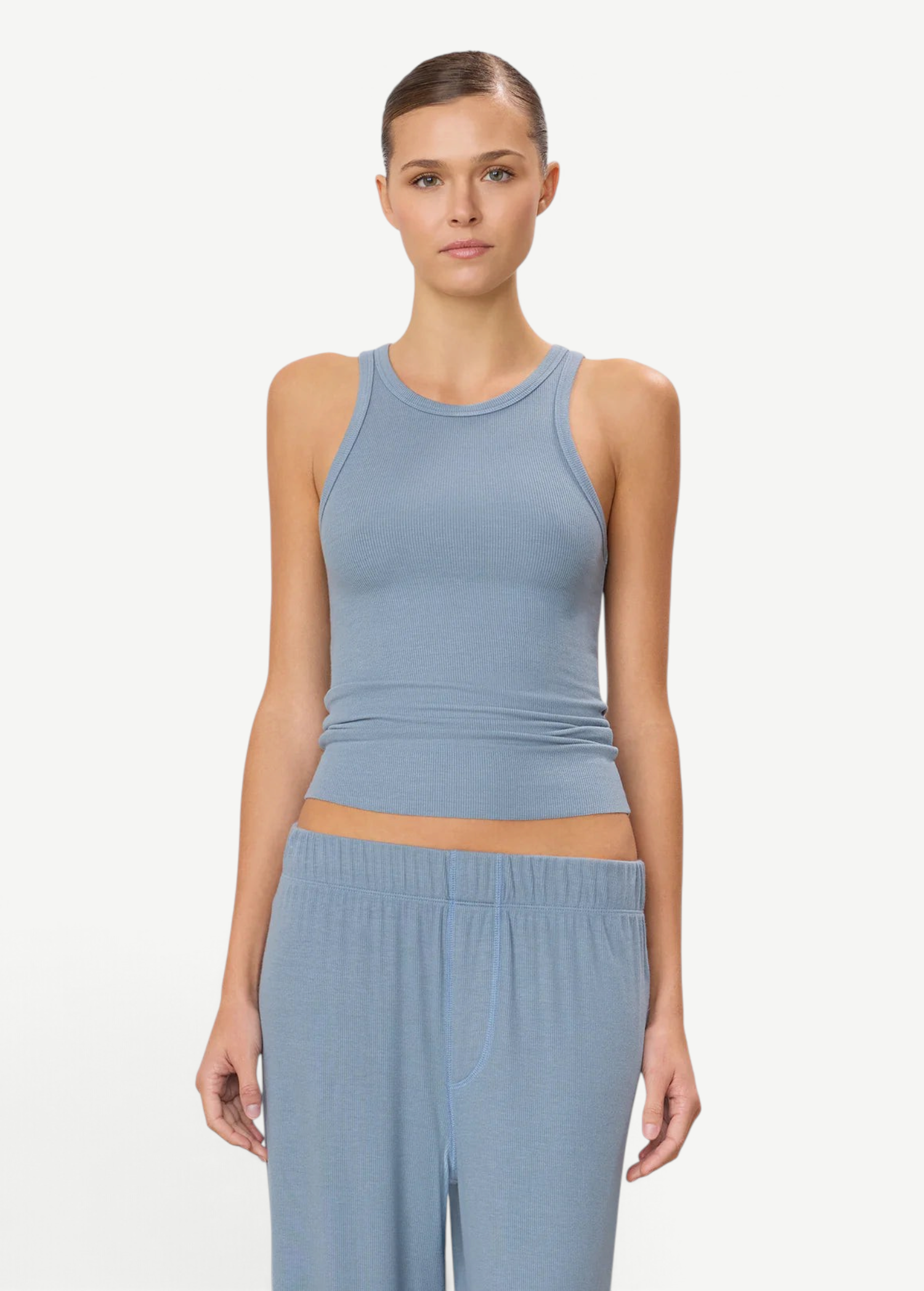 KABE SHOP INC high neck fitted tank in blue ribbed fabric worn by a model against a neutral background