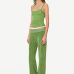 A person wearing a green tank top layered over a white tank top, paired with green wide-leg Low Rise Lounge Pant and tan slip-on shoes.