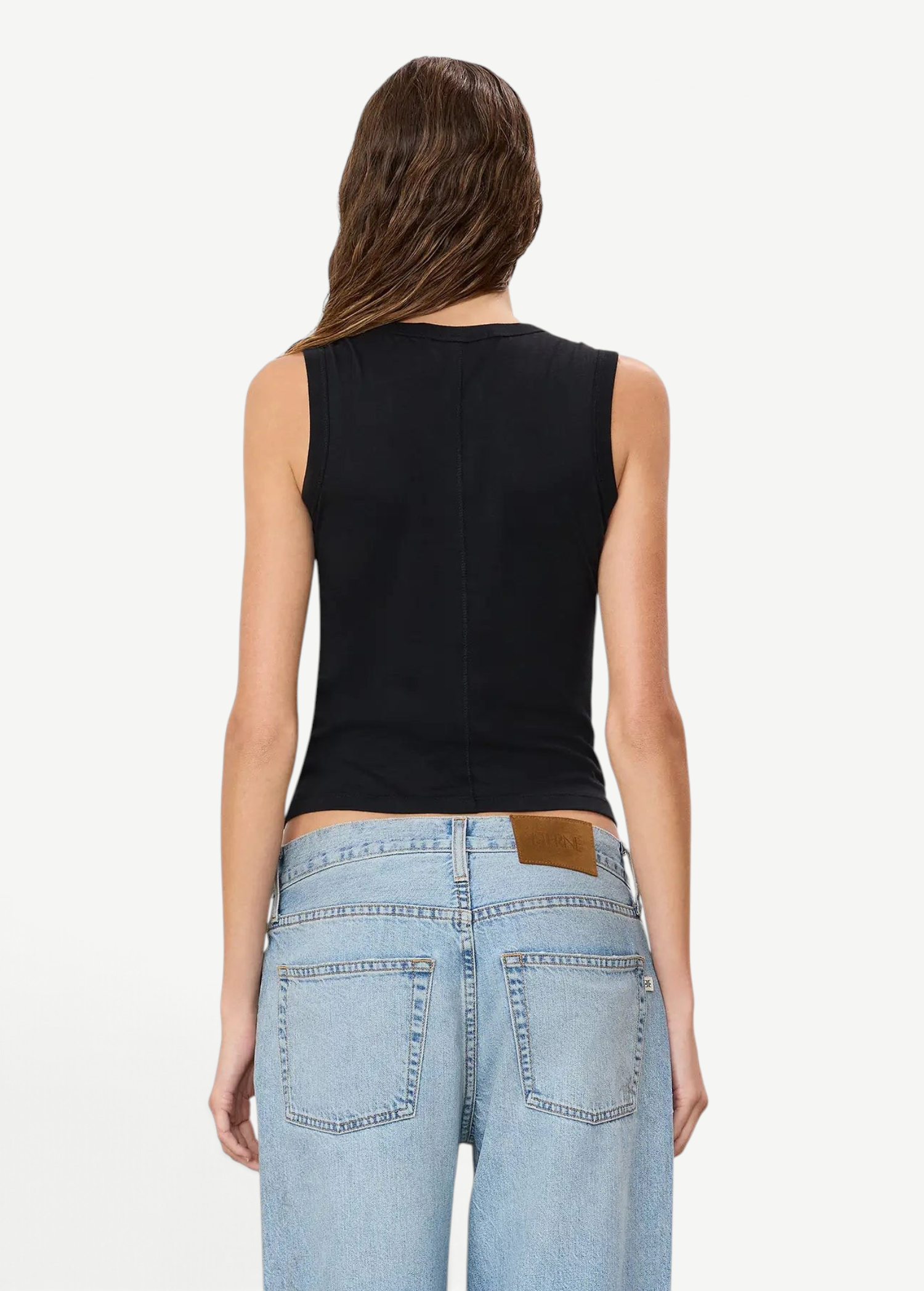 Back view of a model wearing a KABE SHOP INC black fitted muscle tank top made from a soft cotton-modal blend.
