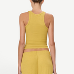 Back view of a woman wearing a KABE SHOP INC yellow ribbed high neck fitted tank top with a slim silhouette.