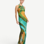 Model wearing a KABE SHOP INC Magdalena long silk maxi dress with a halter neckline and landscape print