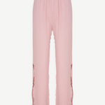 KABE SHOP INC Malaika pants in light pink with a textured fabric, straight-leg fit, and side button detailing.