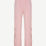 KABE SHOP INC Malaika pants in light pink with a textured fabric, straight-leg fit, and side button detailing.