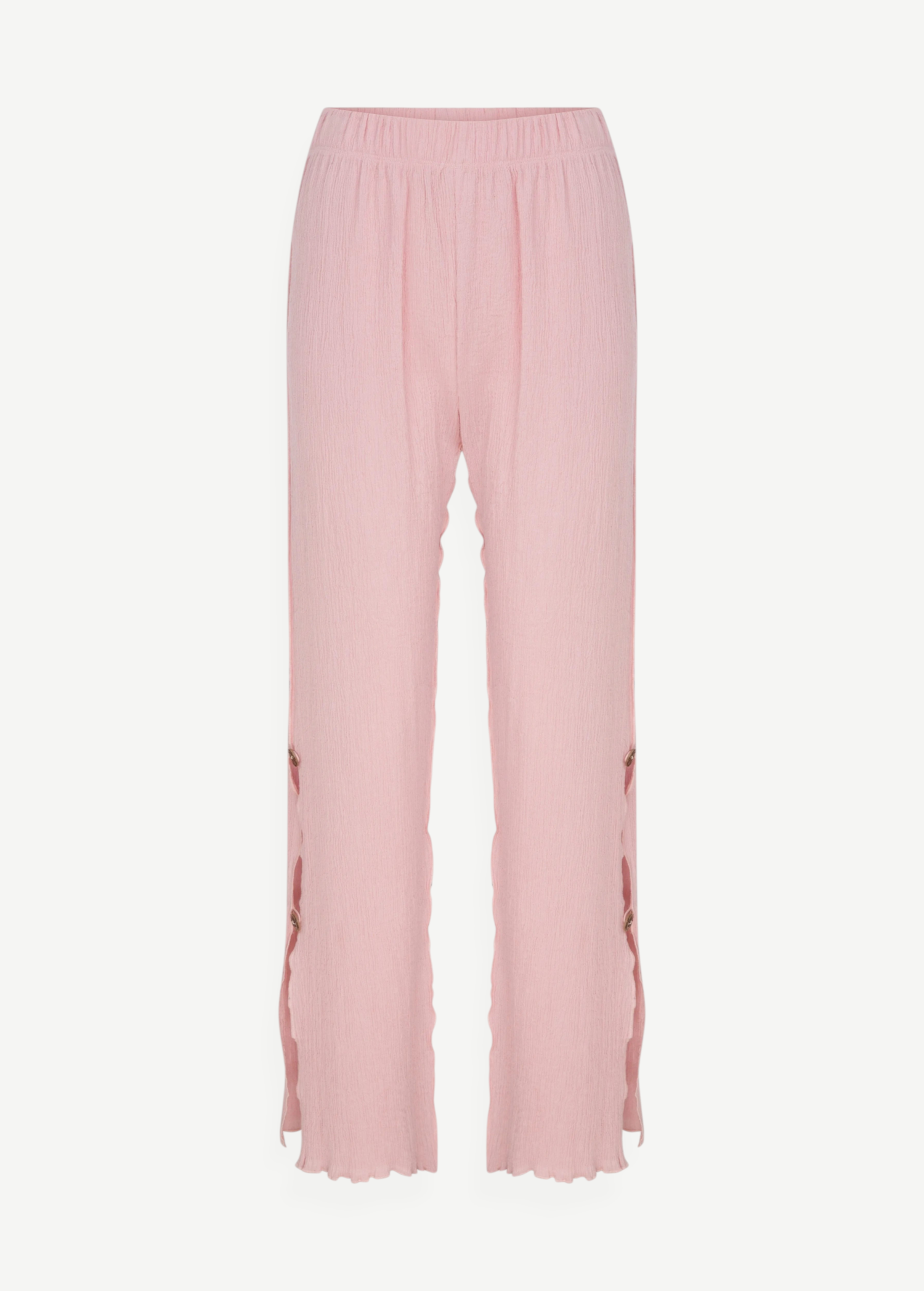 KABE SHOP INC Malaika pants in light pink with a textured fabric, straight-leg fit, and side button detailing.