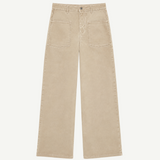 Cold Dye Boyfriend Jeans with Patch Pockets—these beige wide-leg jeans feature front patch pockets, a button and zipper closure, and visible stitching, shown laid flat on a white background.
