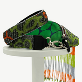 KABE SHOP INC Verdaloo bag with green patterned fabric, beaded strap, and long multi-colored beaded fringe detail.