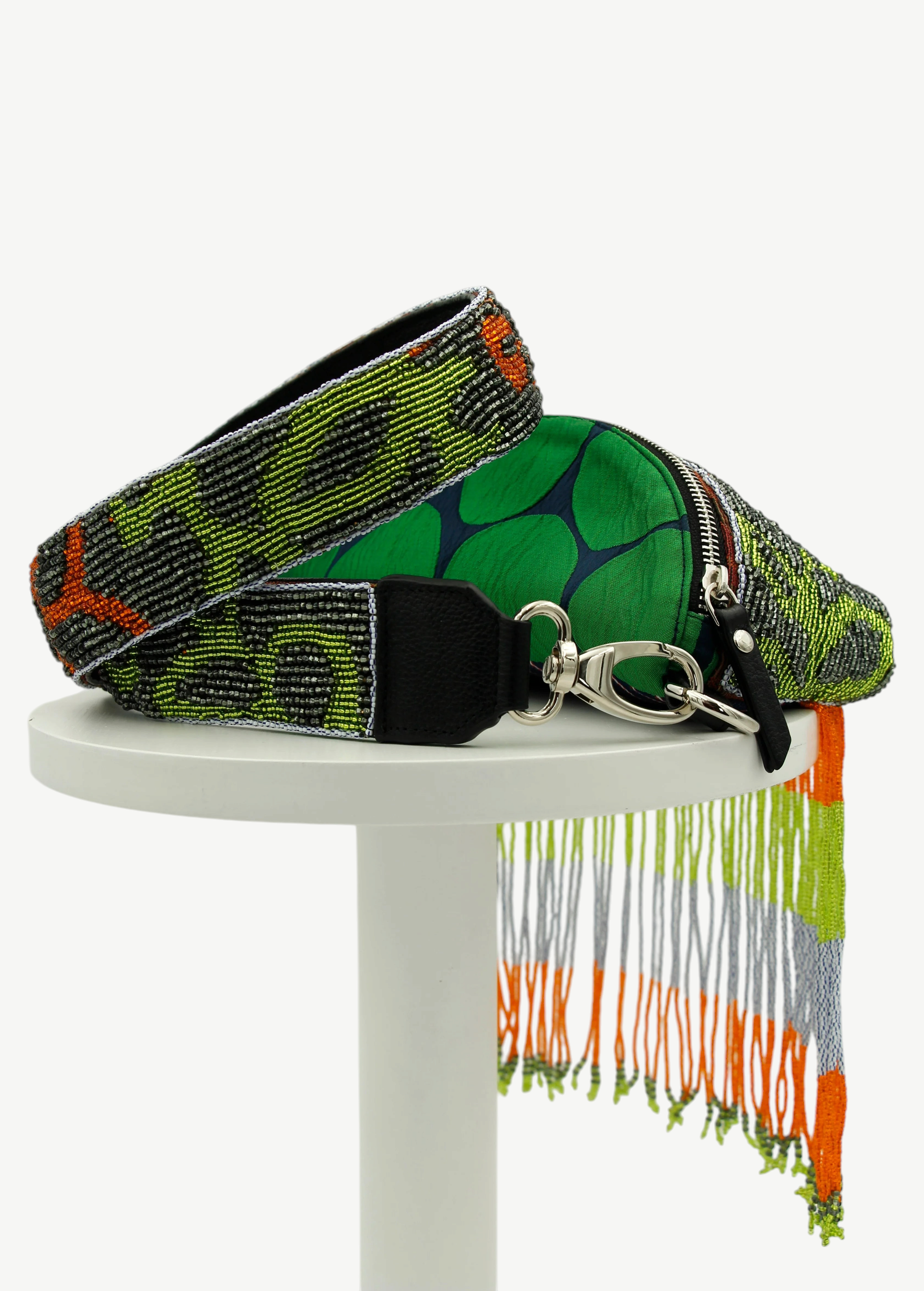 KABE SHOP INC Verdaloo bag with green patterned fabric, beaded strap, and long multi-colored beaded fringe detail.