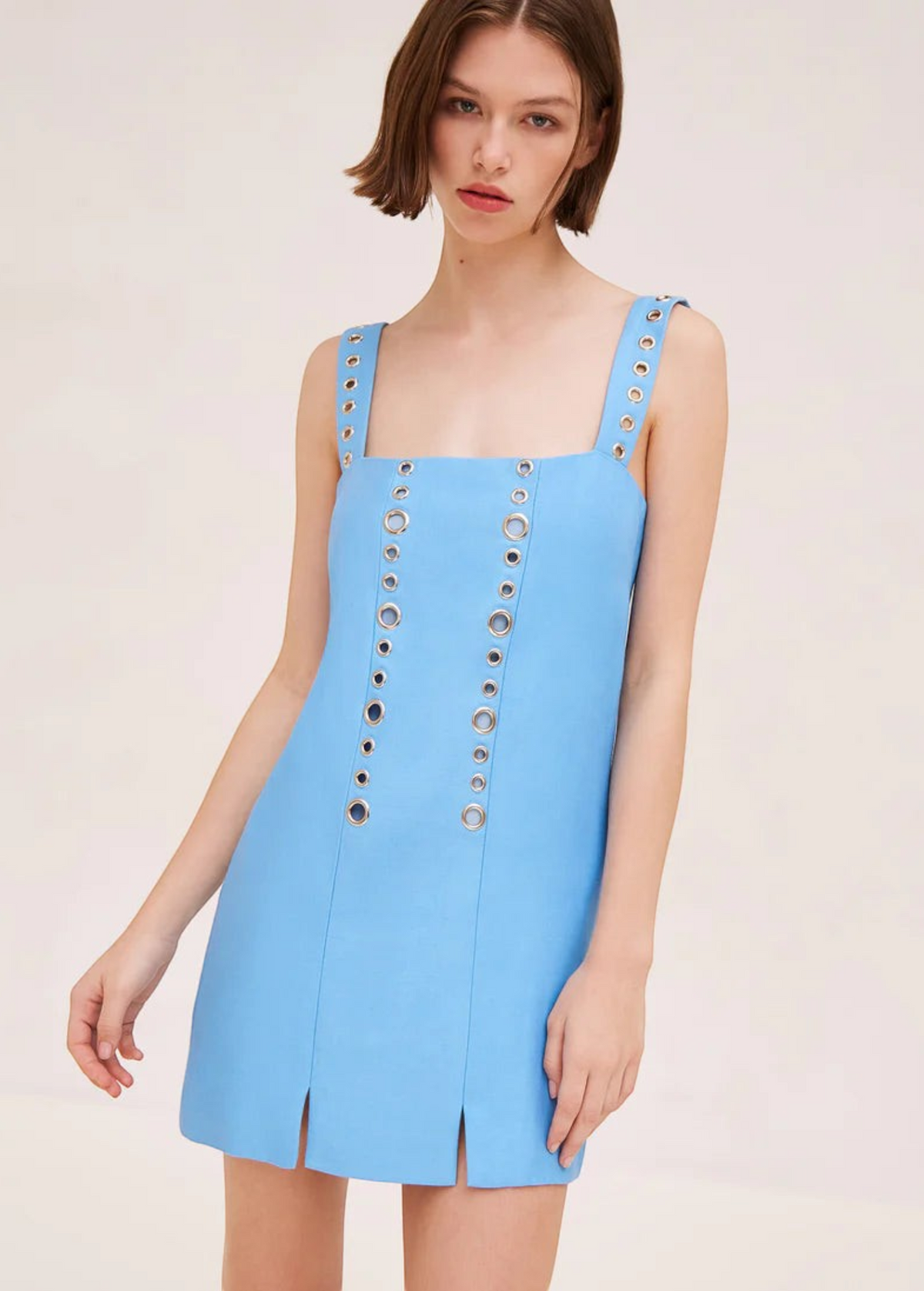 KABE SHOP INC Micaela light blue mini dress with silver grommet details on straps and bodice and front slits.