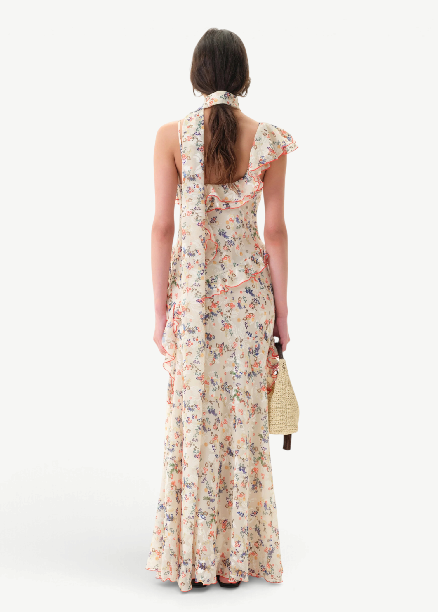 Back view of KABE SHOP INC Monica dress featuring floral print, ruffle details, and a matching detachable scarf.
