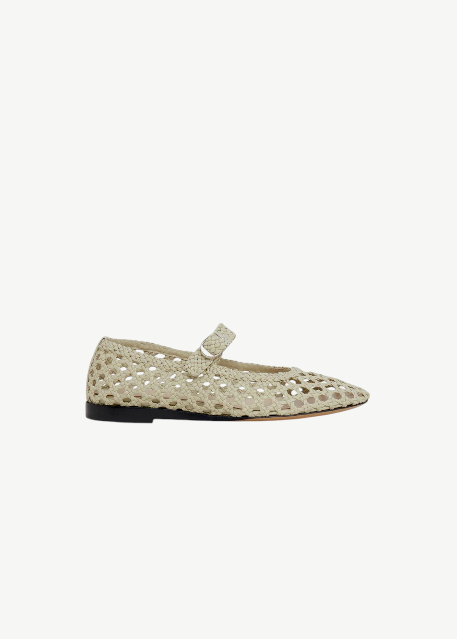 A single beige Mary Jane Woven Leather Shoe is displayed facing left on a plain white background, featuring a handwoven goatskin upper, pointed toe, low black heel, and an instep strap with buckle fastening.