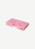 A pink, rectangular Miami Backgammon Board Game with a marbled finish, gold latches, and a built-in handle is displayed closed on a white background, evoking the look of an elegant gift box.