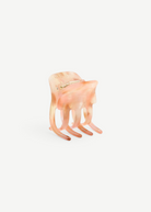 KABE SHOP INC mini claw hair clip in a translucent blush pink bio-acetate with a marbled finish