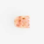 KABE SHOP INC handcrafted mini claw hair clip in a translucent peach and cream marbled Italian bio-acetate finish.