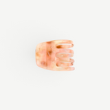 KABE SHOP INC handcrafted mini claw hair clip in a translucent peach and cream marbled Italian bio-acetate finish.