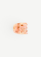 KABE SHOP INC handcrafted mini claw hair clip in a translucent peach and cream marbled Italian bio-acetate finish.