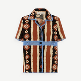 KABE SHOP INC Nera shirt featuring a brown and cream ikat print with contrasting blue crochet trim and button front.
