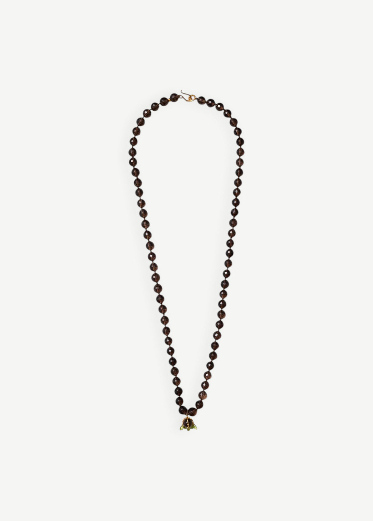 KABE SHOP INC Lark Drip necklace featuring faceted smoky quartz beads and a sculptural gold claw pendant with peridot