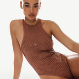 Woman wearing a brown sequin swimsuit on a white background