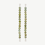 Two vertical strands of round, green marbled beads with wire hooks at each end serve as elegant jewelry straps for the Dolores Top Classic Swimwear, set against a plain light background.