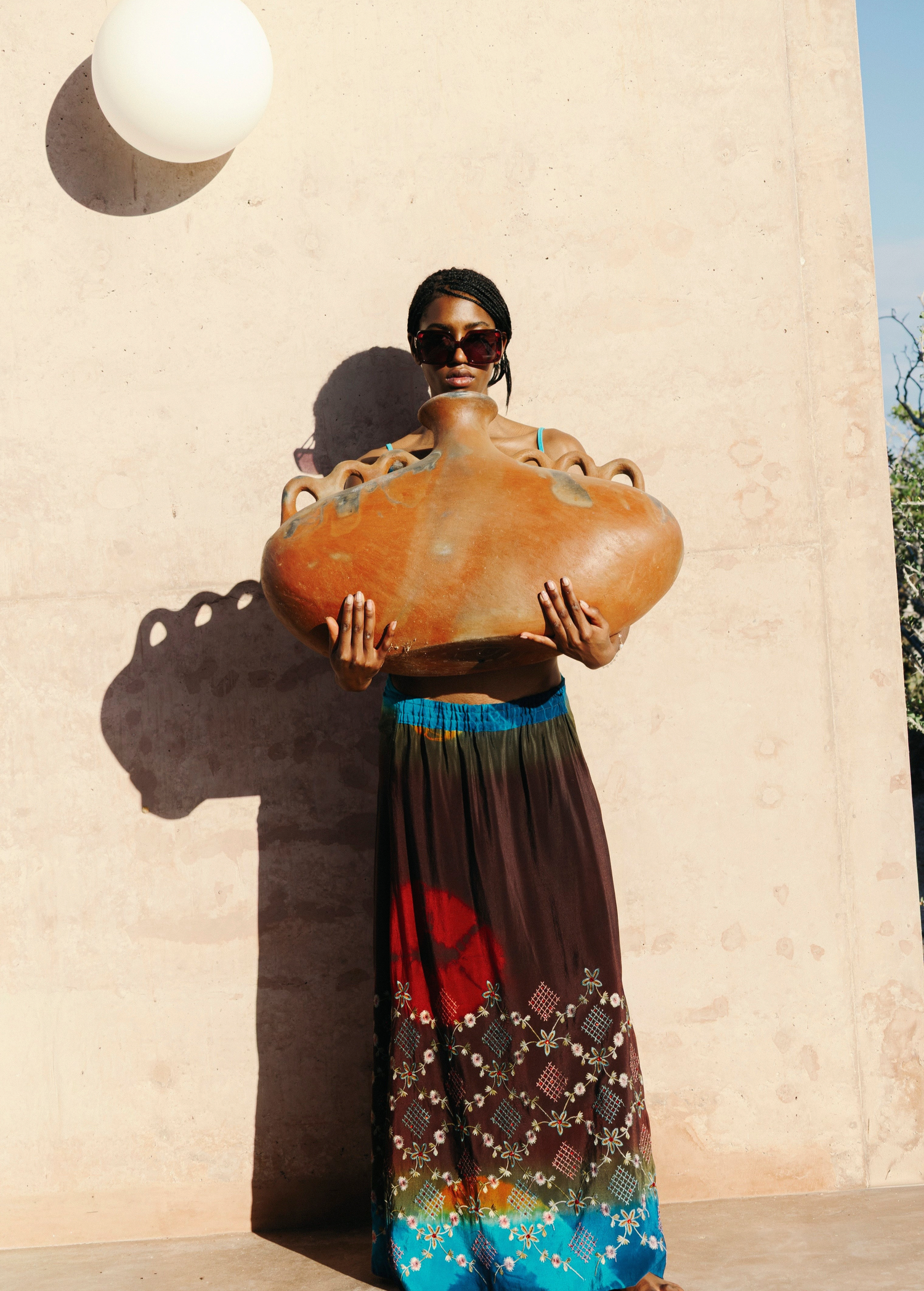 KABE SHOP INC Jupe Chantal bohemian maxi skirt with vibrant tie-dye patterns and intricate embroidery on a model