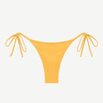 Praia Bottom in yellow, featuring adjustable side tie strings and crafted from eco-friendly swimwear material, displayed on a white background.