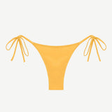 Praia Bottom in yellow, featuring adjustable side tie strings and crafted from eco-friendly swimwear material, displayed on a white background.