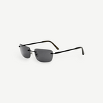 Paris rimless sunglasses feature dark rectangular lenses, thin black metal arms, and black ear tips, delivering a timeless 2000s-inspired style with reliable UV protection, as shown on a plain white background.